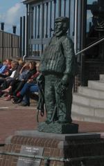 Statue of Jacob Glas, inventor of the life vest, in Egmond exemplifies the Dutch tendency to celebrate helpful, common people in statuary